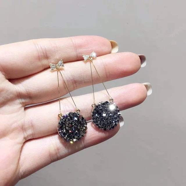 Black Studded Bow Sleek Earrings