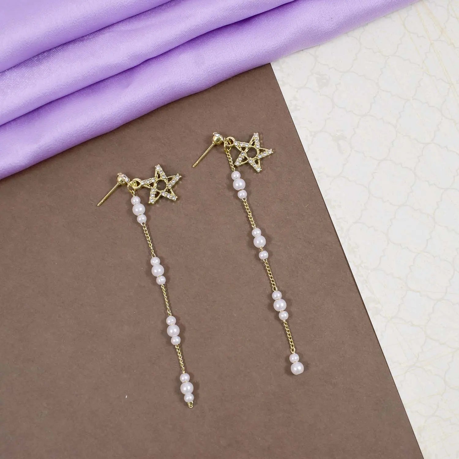 Studded star pearl dangle gold earrings
